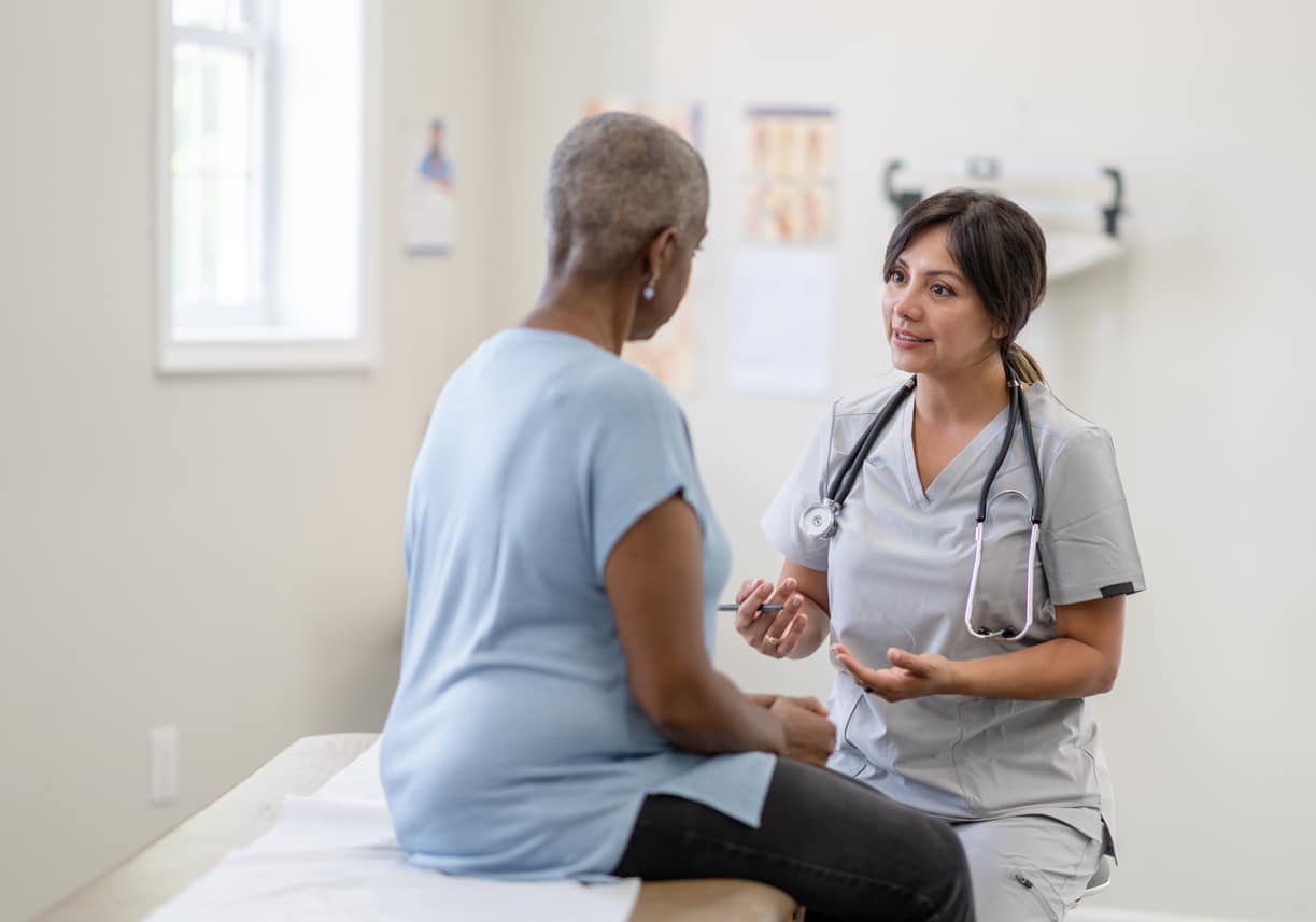 Doctor with cancer patient